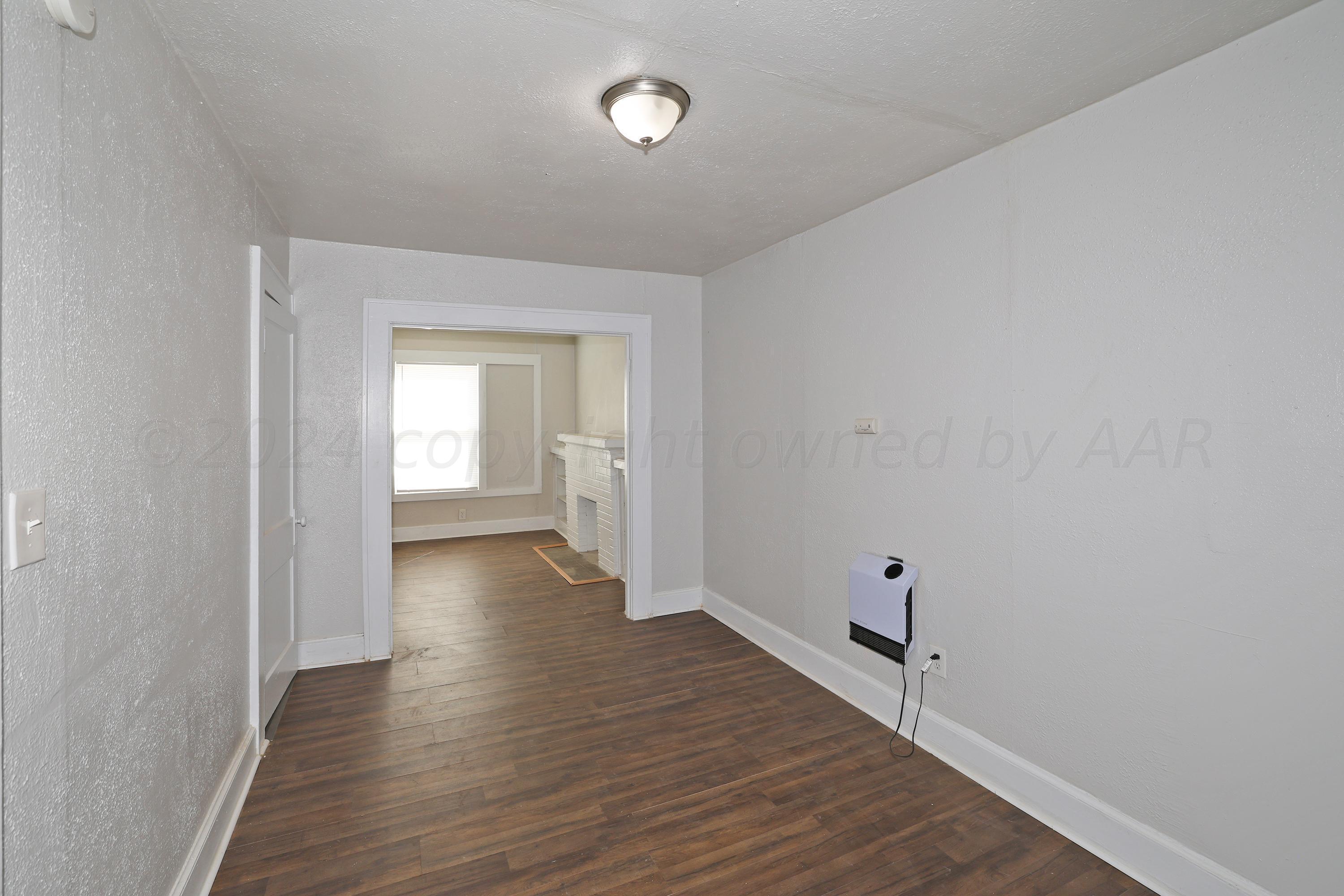 1506 Southwest 11th Avenue Amarillo, TX 79101 - Photo 5 of 10 a view of a room with wooden floor