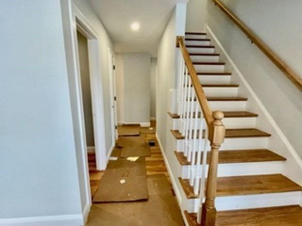 39 Staples Street Billerica, MA 01821 - Photo 14 of 25 a view of entryway and hall with wooden floor