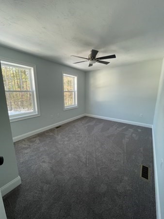 39 Staples Street Billerica, MA 01821 - Photo 18 of 25 a view of an empty room with a window