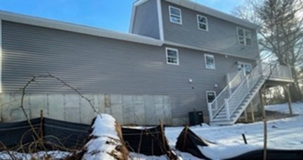 39 Staples Street Billerica, MA 01821 - Photo 24 of 25 a front view of a house with parking space