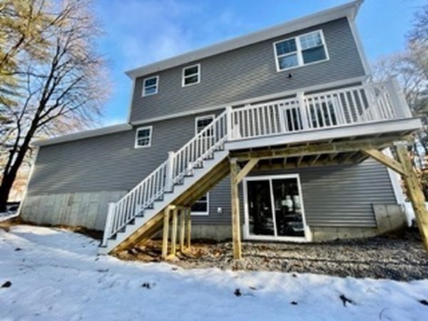 39 Staples Street Billerica, MA 01821 - Photo 25 of 25 a view of a house with wooden stairs