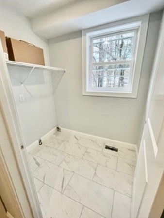 39 Staples Street Billerica, MA 01821 - Photo 10 of 25 a view of an empty room with a window