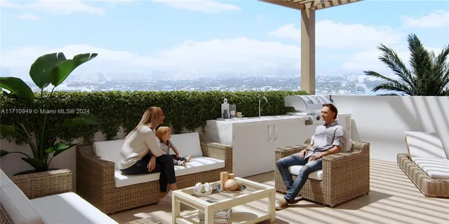 a view of a terrace with couches and wooden floor