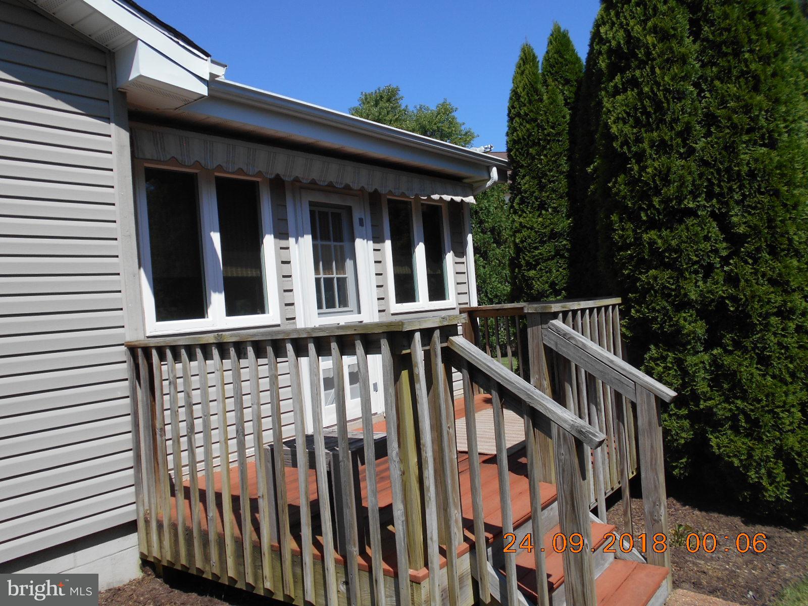 506 Harbor Road Ocean View, DE 19970 - Photo 20 of 30 Deck with awning off enclosed porch.