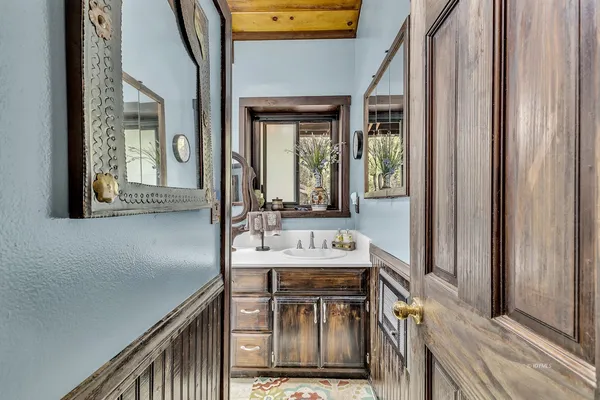 a picture of a bathroom with a shower
