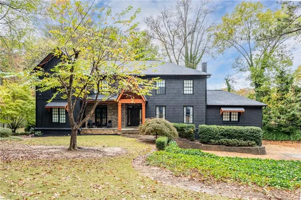 a front view of a house with garden
