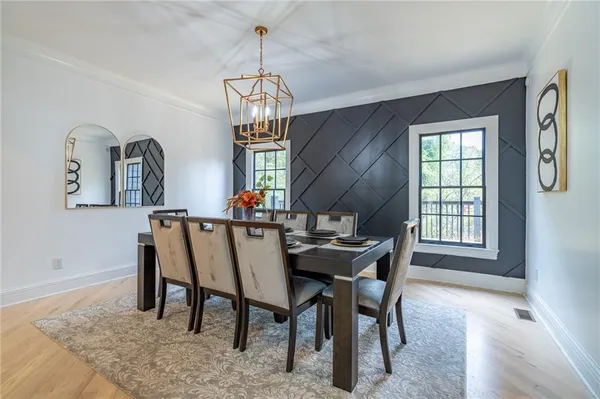 a kitchen with stainless steel appliances kitchen island granite countertop a stove microwave and sink