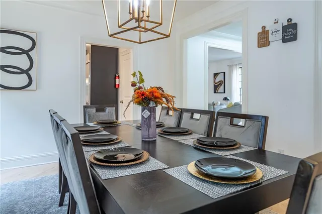 a view of a dining room with furniture and a wooden floor