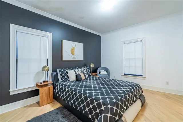 a bedroom with a bed and a ceiling fan