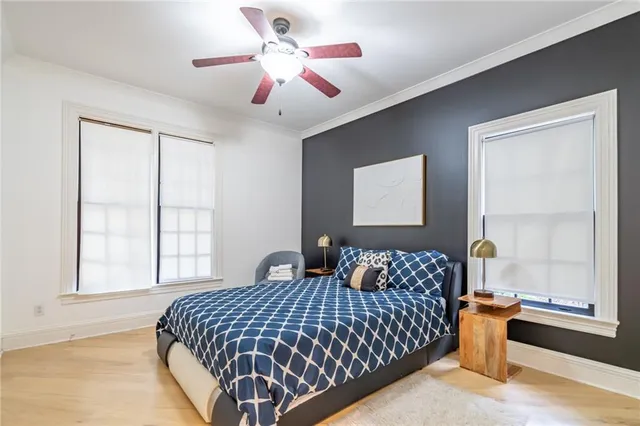 a bedroom with double bed and a window