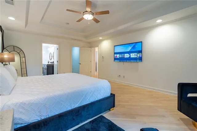 a front view of a house with swimming pool and furniture