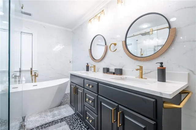 a front view of house with yard and trees in the background