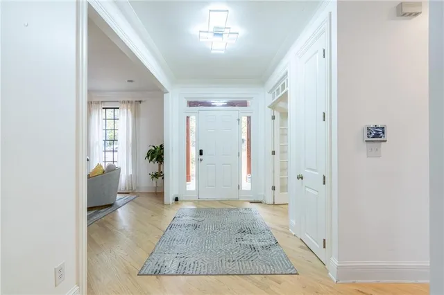 a living room with furniture wooden floor and a chandelier
