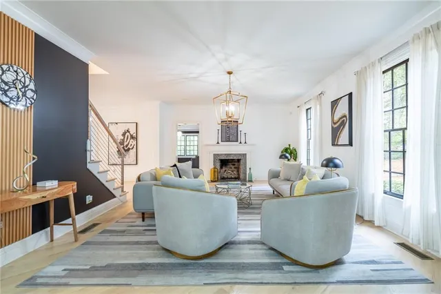 a living room with furniture and a book shelf