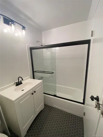 a bathroom with a sink and mirror