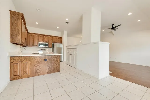 an aerial view of multiple houses with a yard