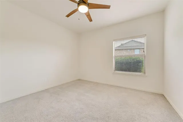 a bathroom with a sink toilet vanity and tub