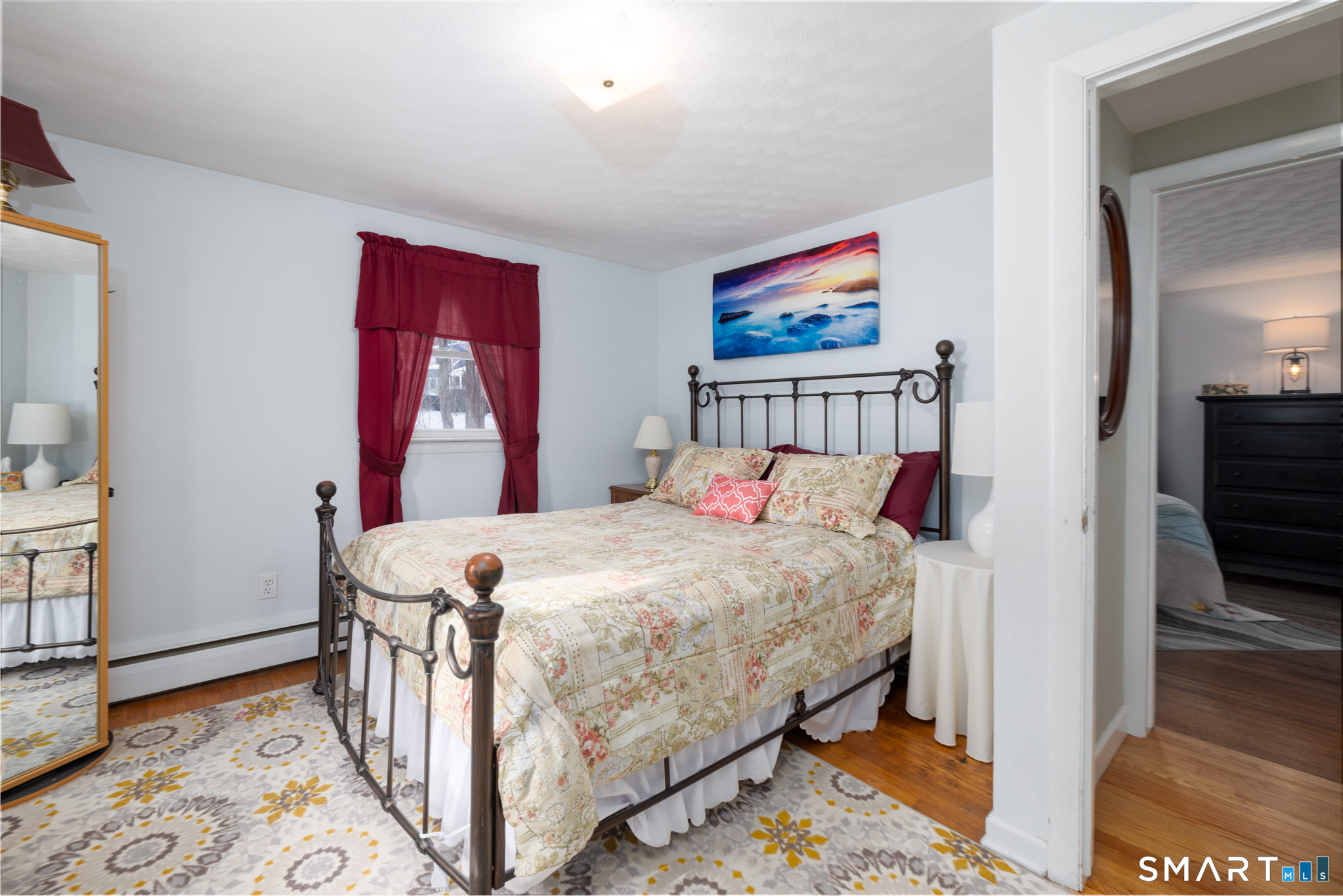 351 Platt Hill Road Winchester, CT 06098 - Photo 18 of 40 a bed room with a bed and a tv