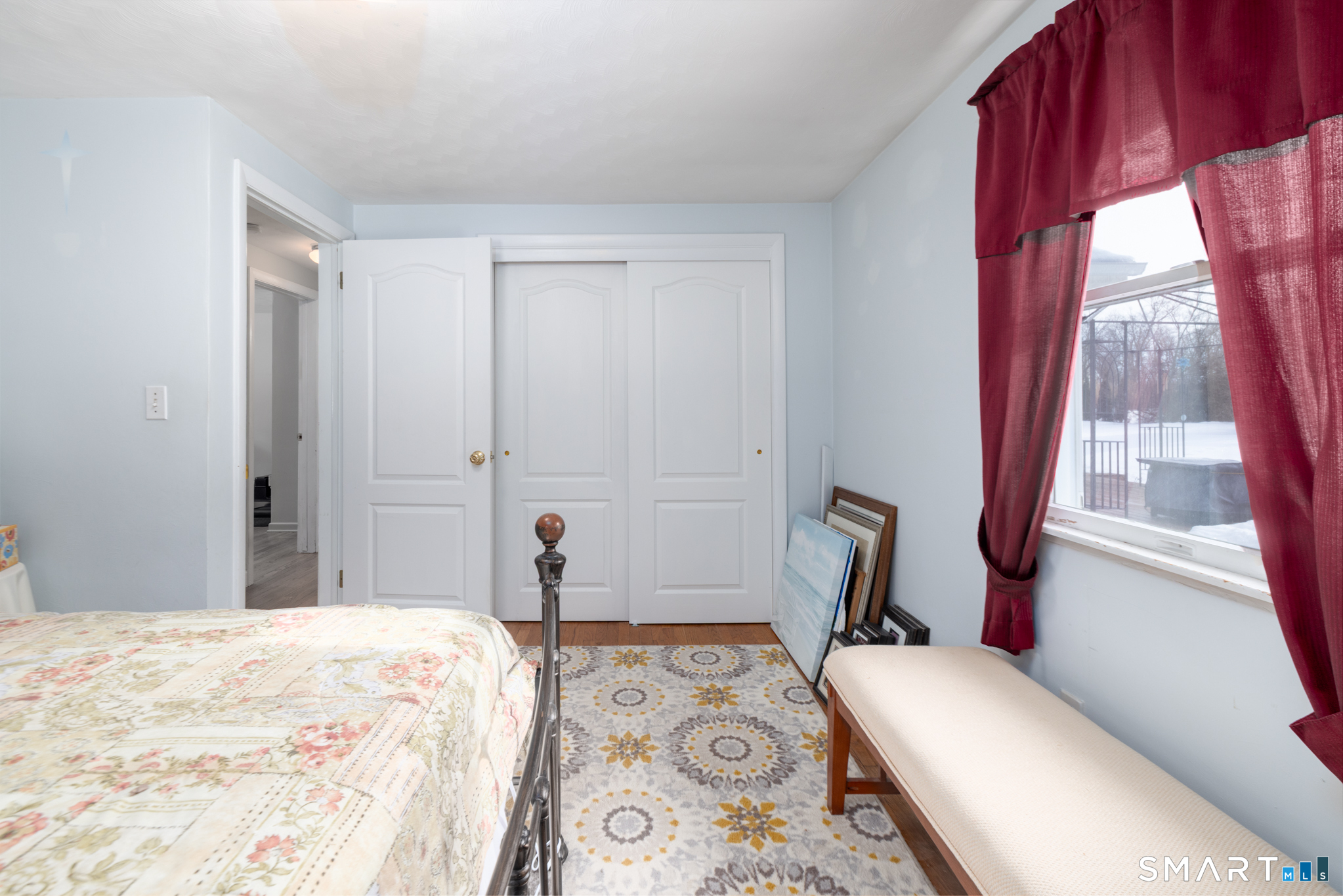 351 Platt Hill Road Winchester, CT 06098 - Photo 19 of 40 a bedroom with a bed and wooden floor