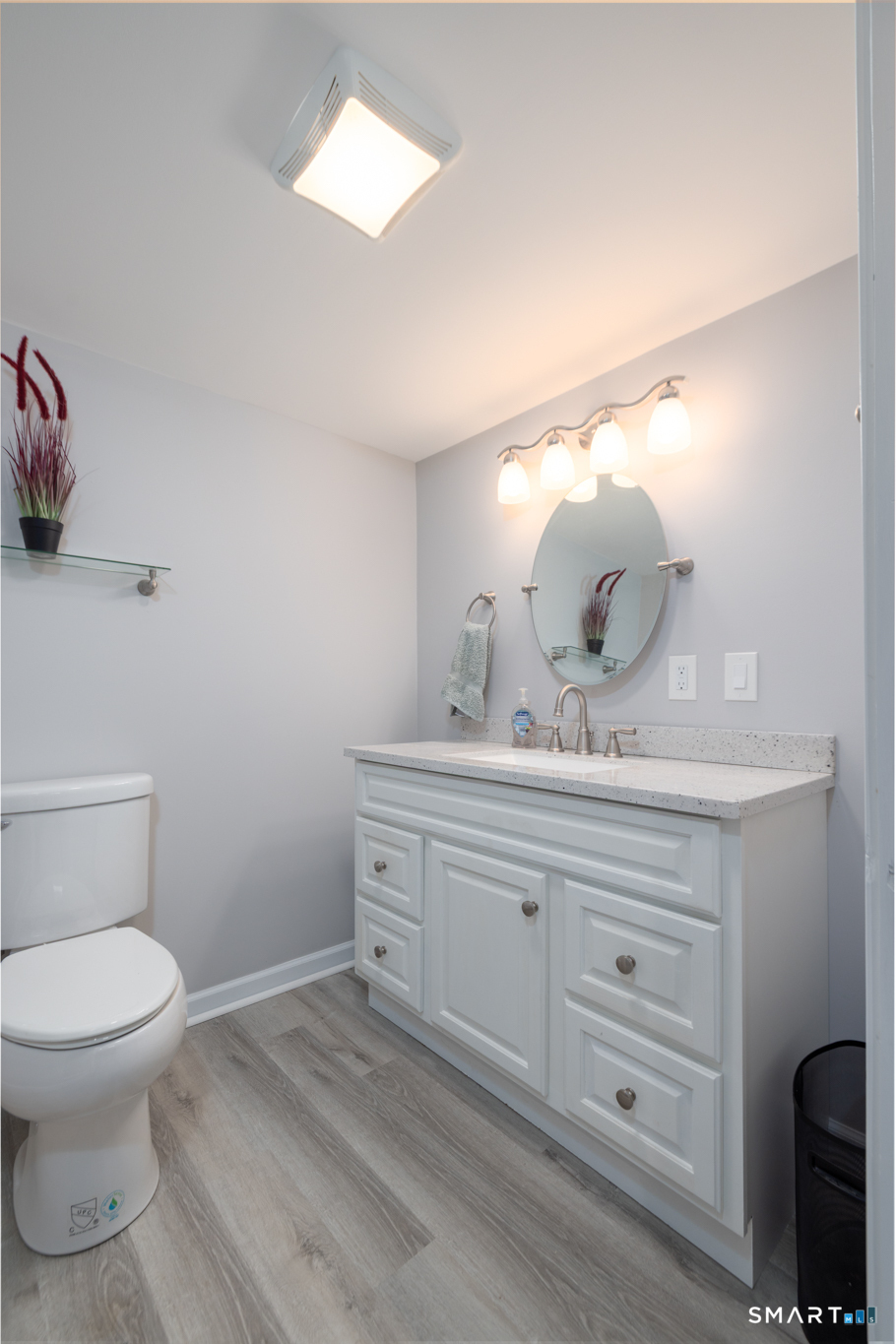 351 Platt Hill Road Winchester, CT 06098 - Photo 27 of 40 a bathroom with a toilet sink and mirror