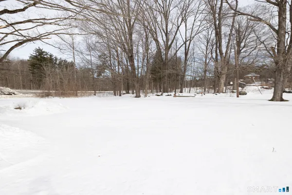 a view of snow on the side of road