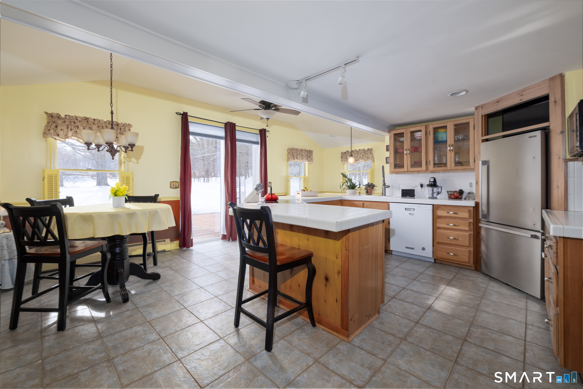 351 Platt Hill Road Winchester, CT 06098 - Photo 7 of 40 a kitchen with a dining table chairs and refrigerator