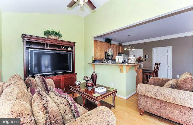 2428 Knapps Way Odenton, MD 21113 - Photo 12 of 30 a living room with furniture and a flat screen tv