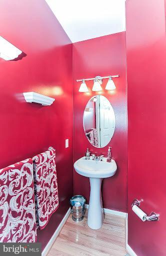 2428 Knapps Way Odenton, MD 21113 - Photo 14 of 30 a bathroom with a sink mirror and vanity