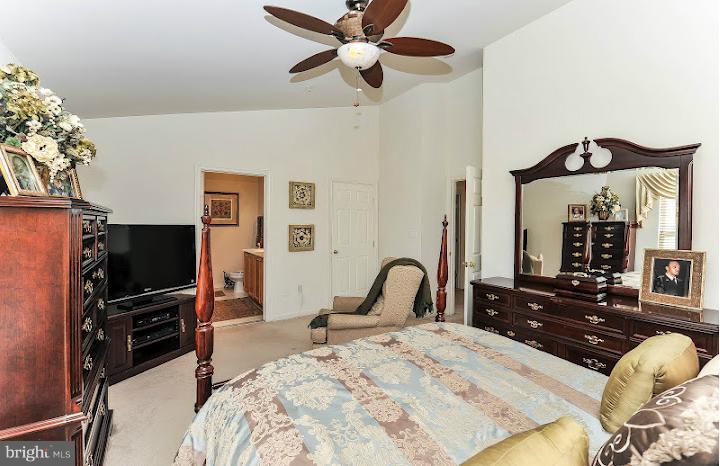 2428 Knapps Way Odenton, MD 21113 - Photo 17 of 30 a bedroom with furniture and a flat screen tv