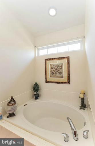 2428 Knapps Way Odenton, MD 21113 - Photo 20 of 30 a bathroom with a tub