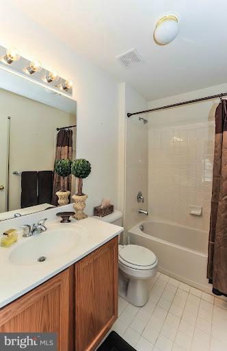 2428 Knapps Way Odenton, MD 21113 - Photo 23 of 30 a bathroom with a sink a toilet and shower