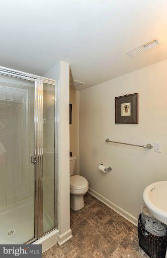 2428 Knapps Way Odenton, MD 21113 - Photo 27 of 30 a bathroom with a toilet and a shower