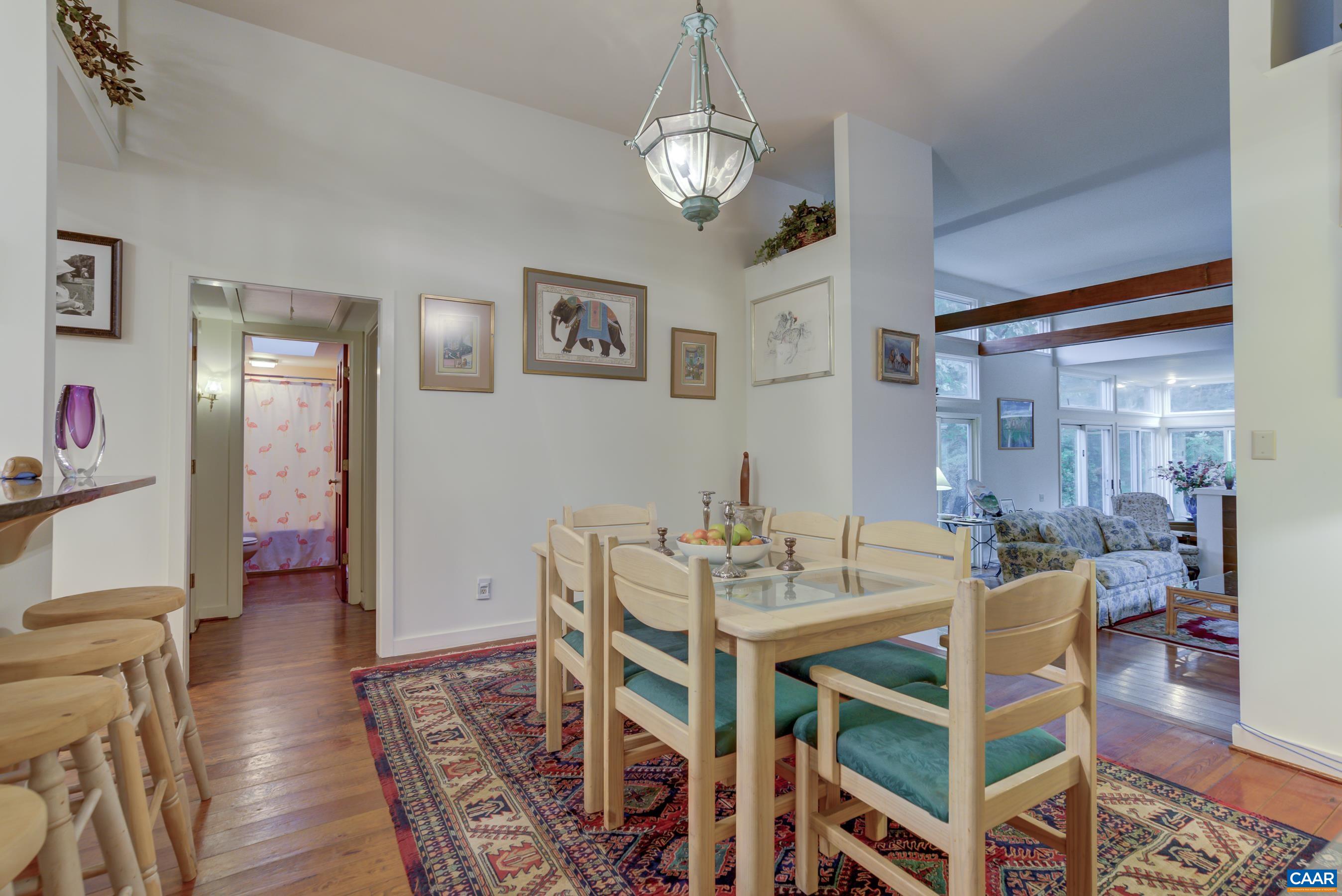 5317 Stony Point Road Barboursville, VA 22923 - Photo 12 of 69 a view of a dining room with furniture wooden floor and a chandelier