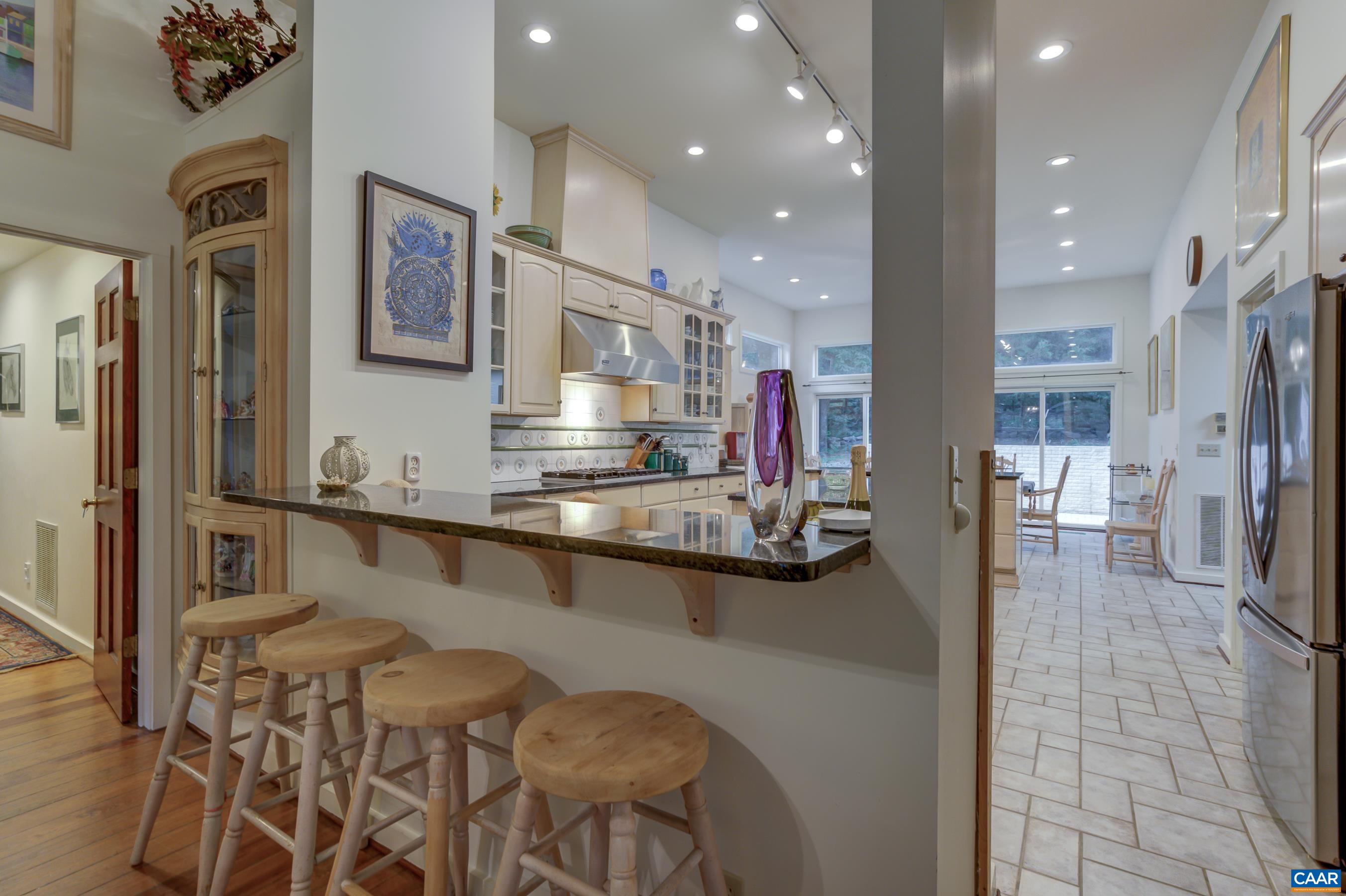 5317 Stony Point Road Barboursville, VA 22923 - Photo 13 of 69 a kitchen with stainless steel appliances kitchen island granite countertop a refrigerator and cabinets