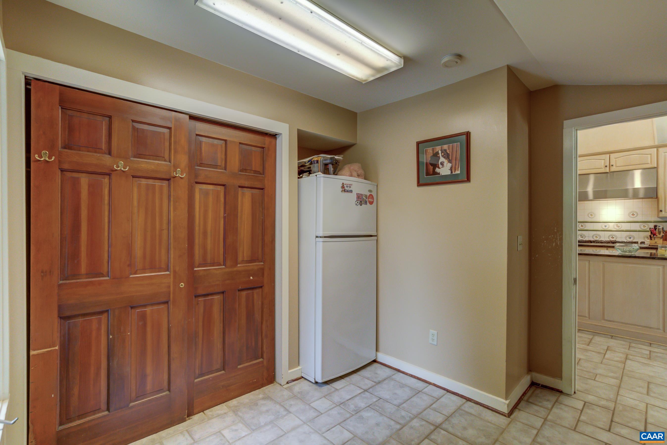 5317 Stony Point Road Barboursville, VA 22923 - Photo 17 of 69 a view of a refrigerator in kitchen and wooden cabinets