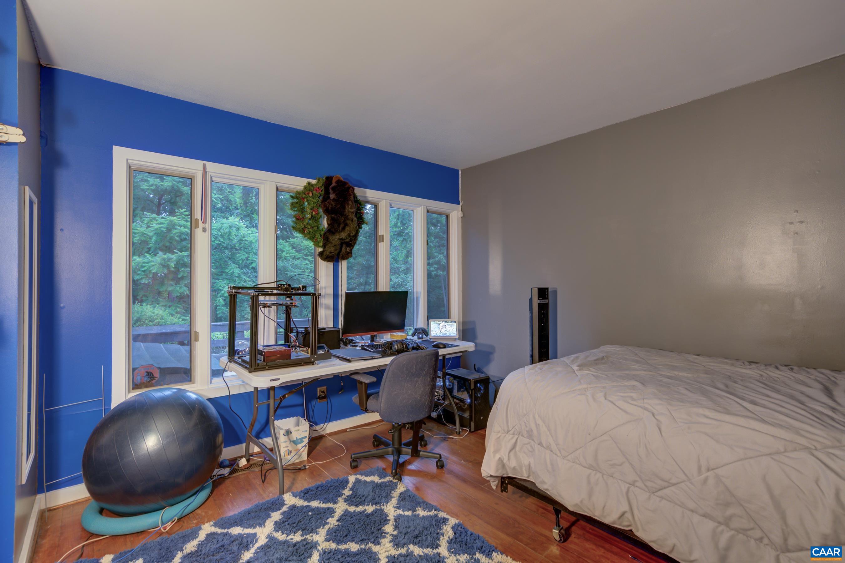 5317 Stony Point Road Barboursville, VA 22923 - Photo 22 of 69 a bedroom with a large bed and a large window