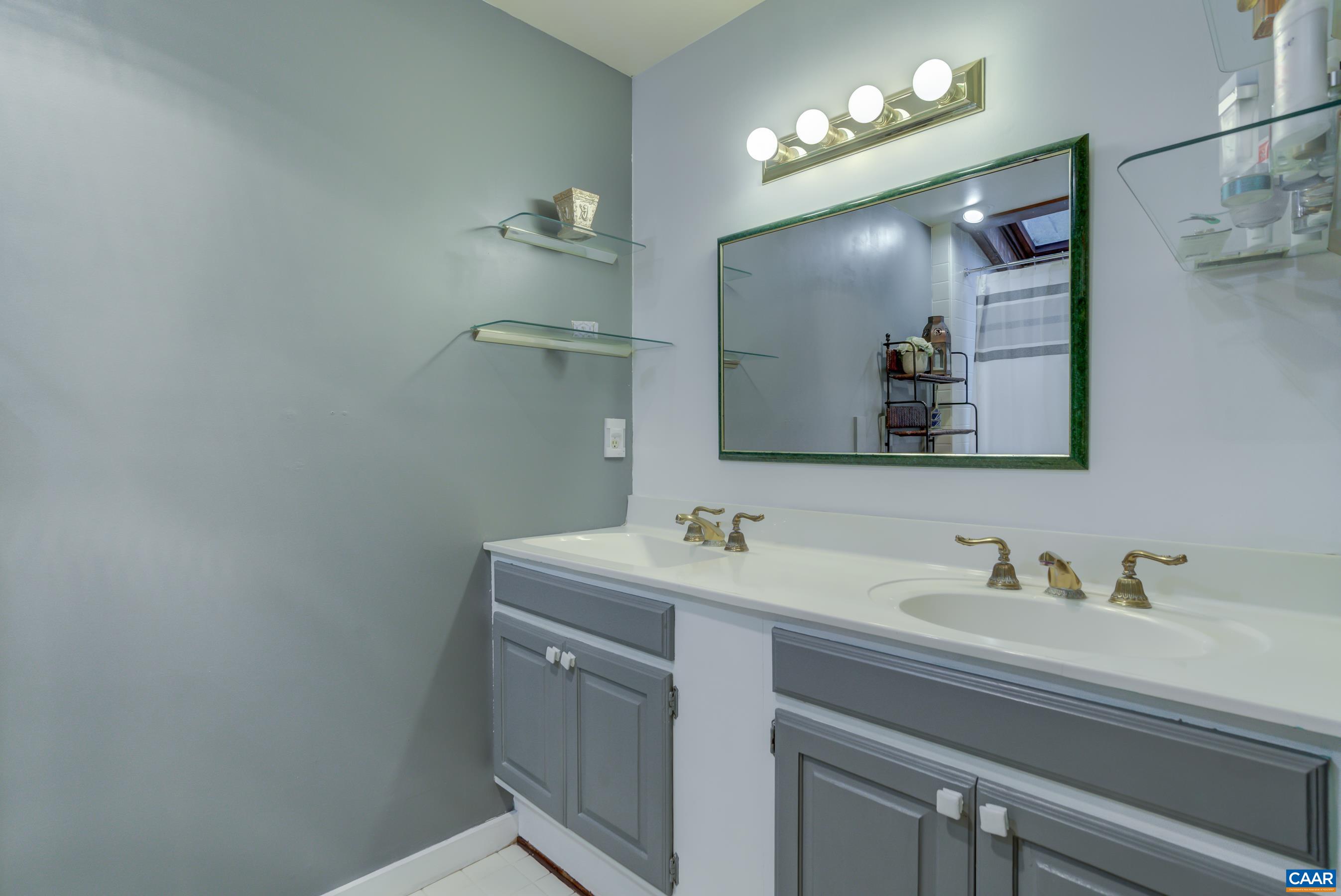 5317 Stony Point Road Barboursville, VA 22923 - Photo 28 of 69 a bathroom with a sink and a mirror