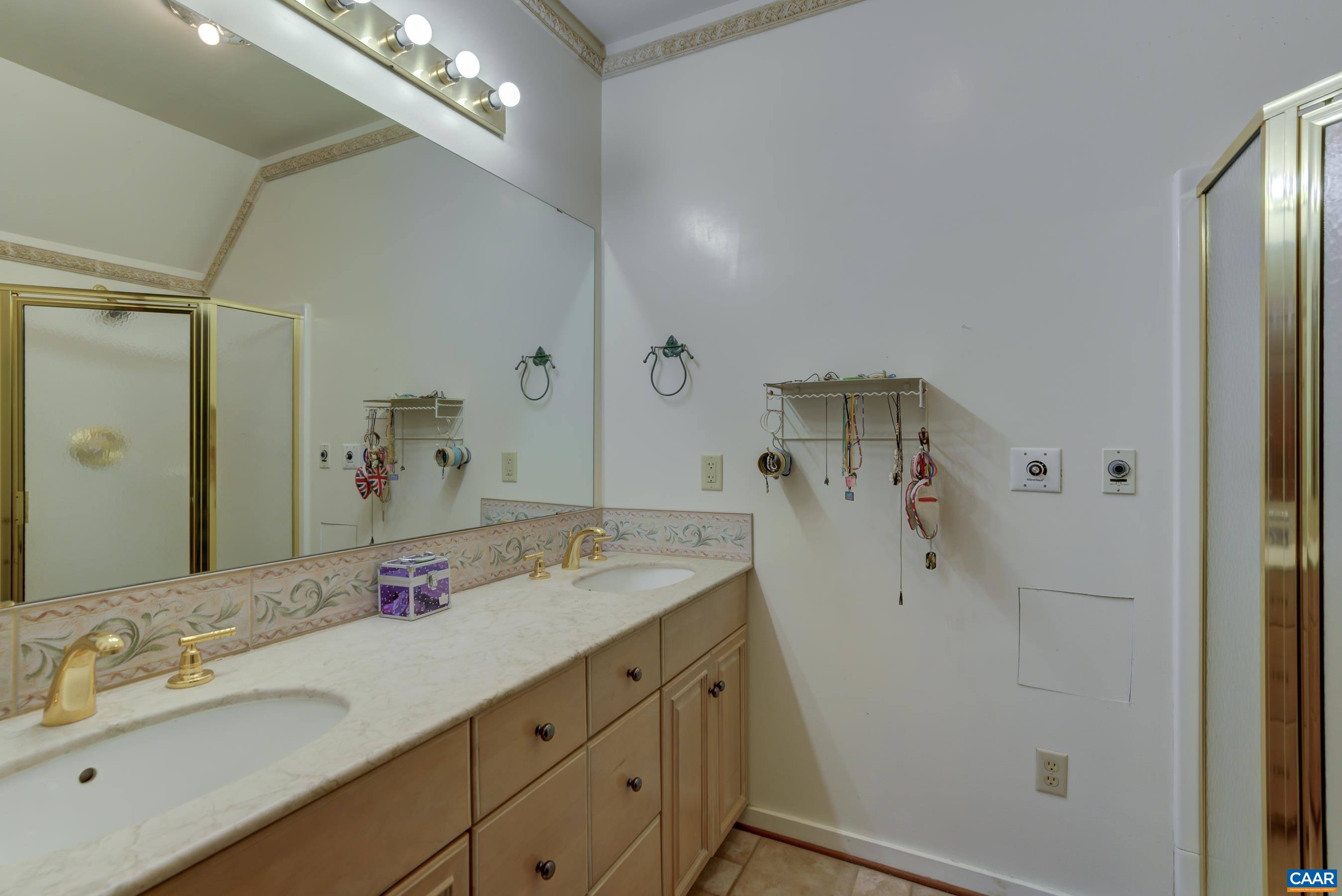 5317 Stony Point Road Barboursville, VA 22923 - Photo 32 of 69 a bathroom with a granite countertop sink a shower and a mirror