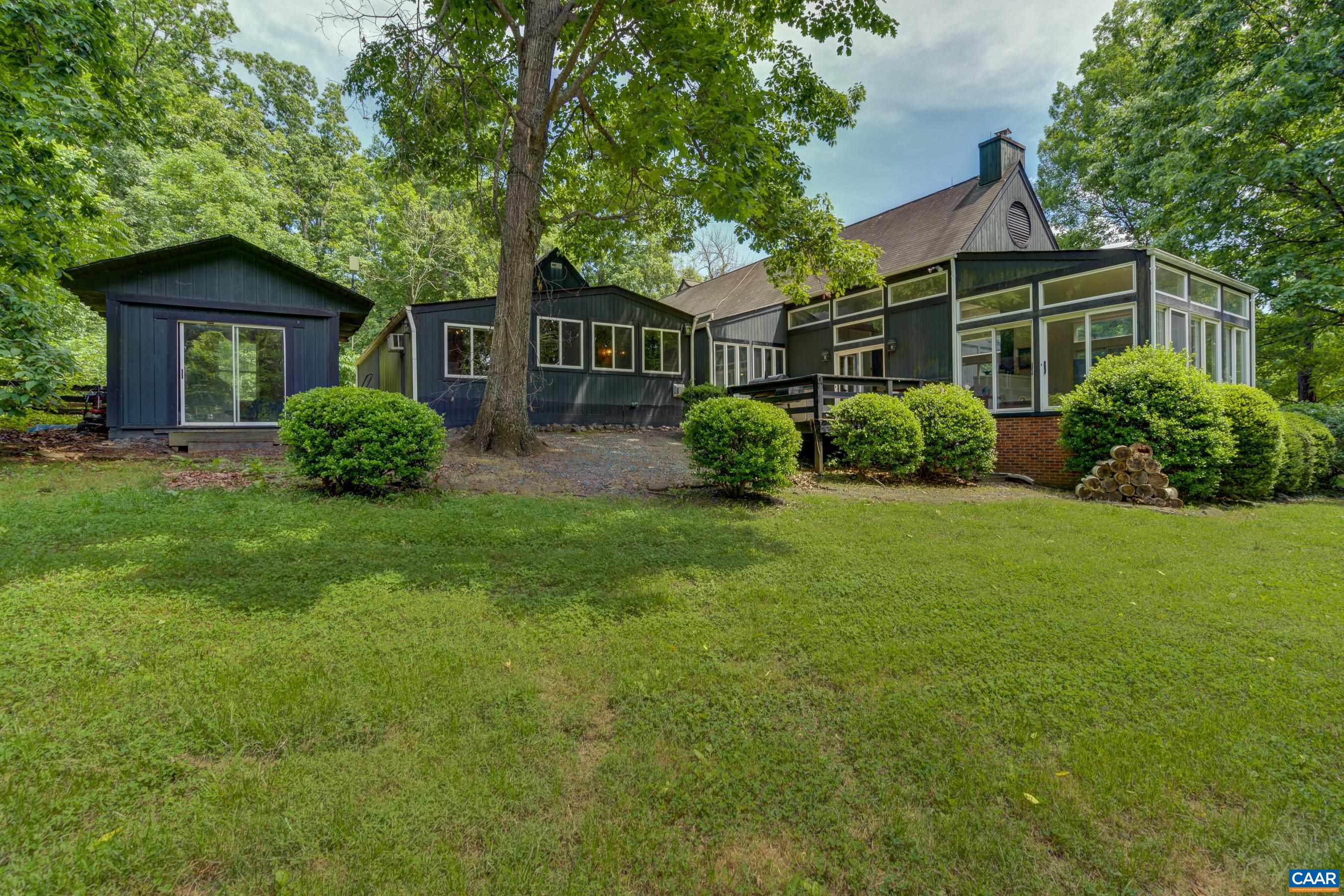 5317 Stony Point Road Barboursville, VA 22923 - Photo 4 of 69 a front view of a house with a garden and plants