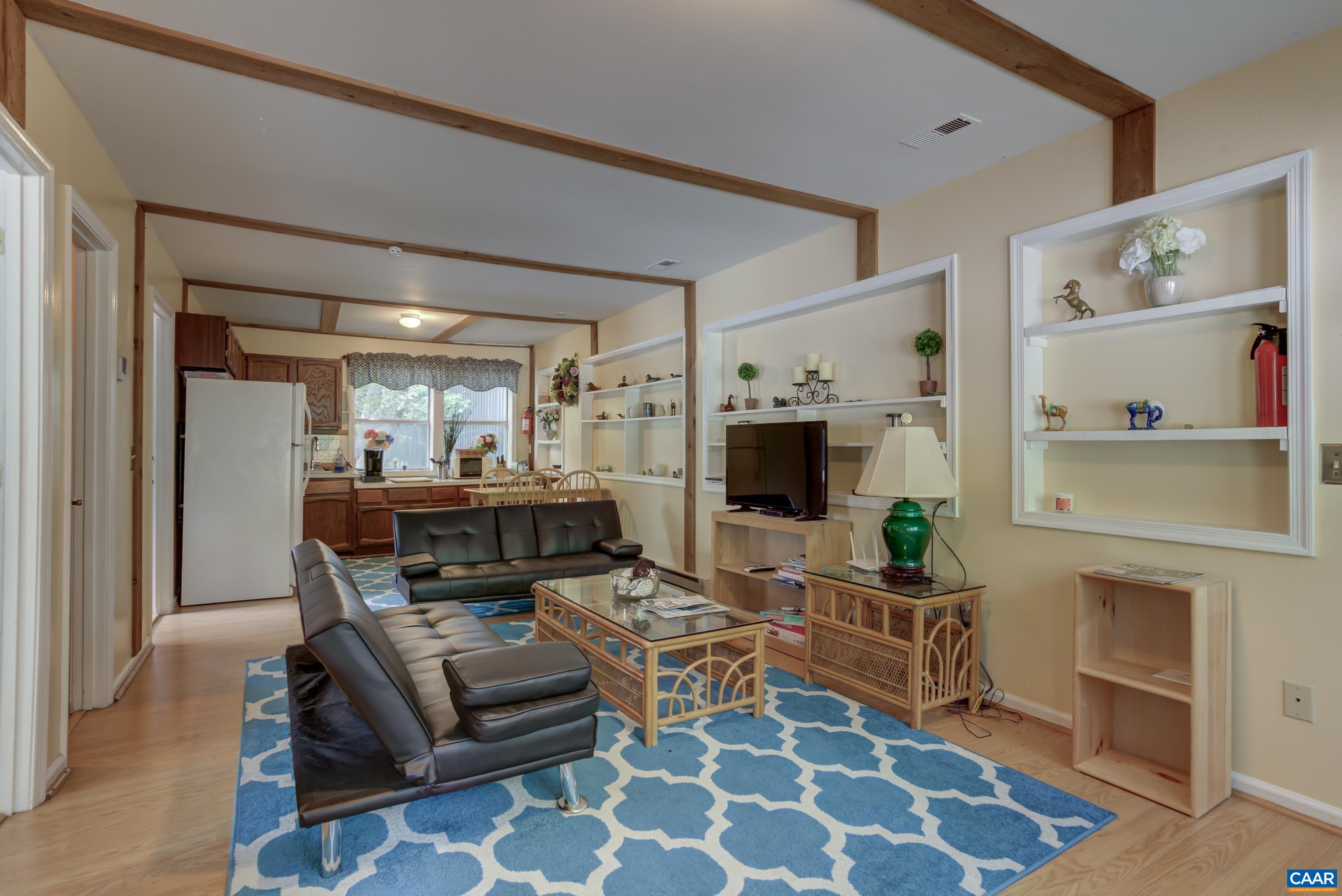 5317 Stony Point Road Barboursville, VA 22923 - Photo 51 of 69 a living room with furniture and a flat screen tv