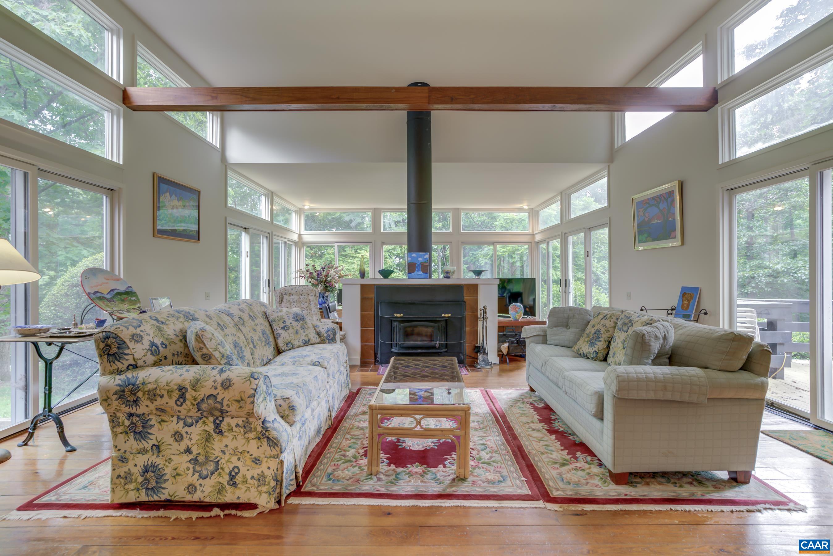 5317 Stony Point Road Barboursville, VA 22923 - Photo 6 of 69 a living room with furniture a fireplace and a large window