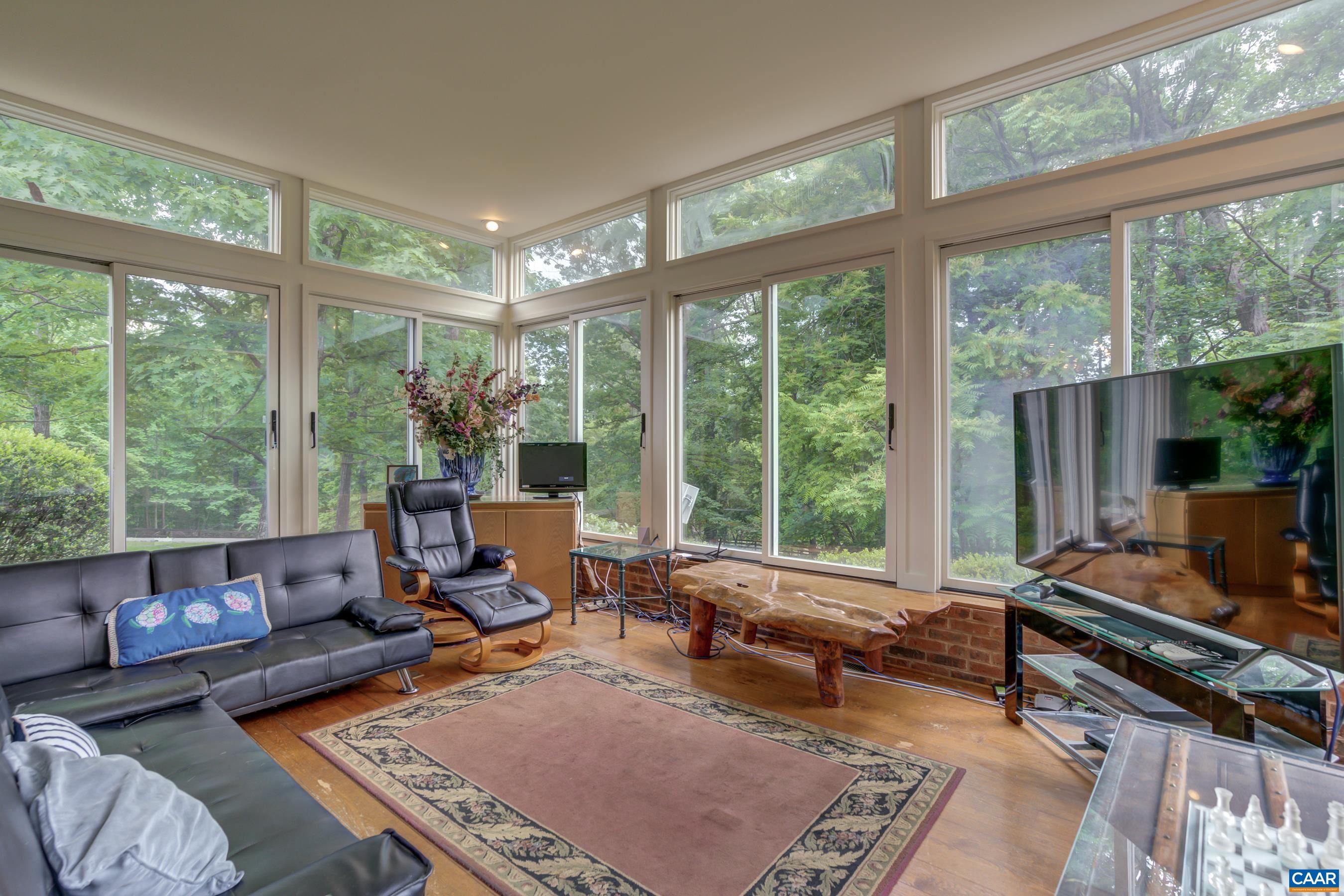 5317 Stony Point Road Barboursville, VA 22923 - Photo 7 of 69 a living room with furniture and a floor to ceiling window