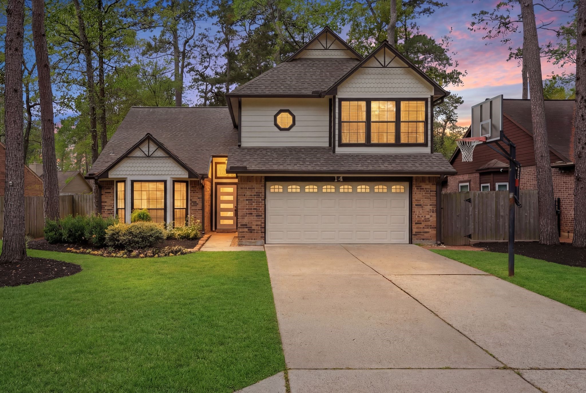 Charming two story home with inviting curb appeal in a peaceful, tree lined setting in the heart of The Woodlands, Texas in The Village of Cochran's Crossing.
