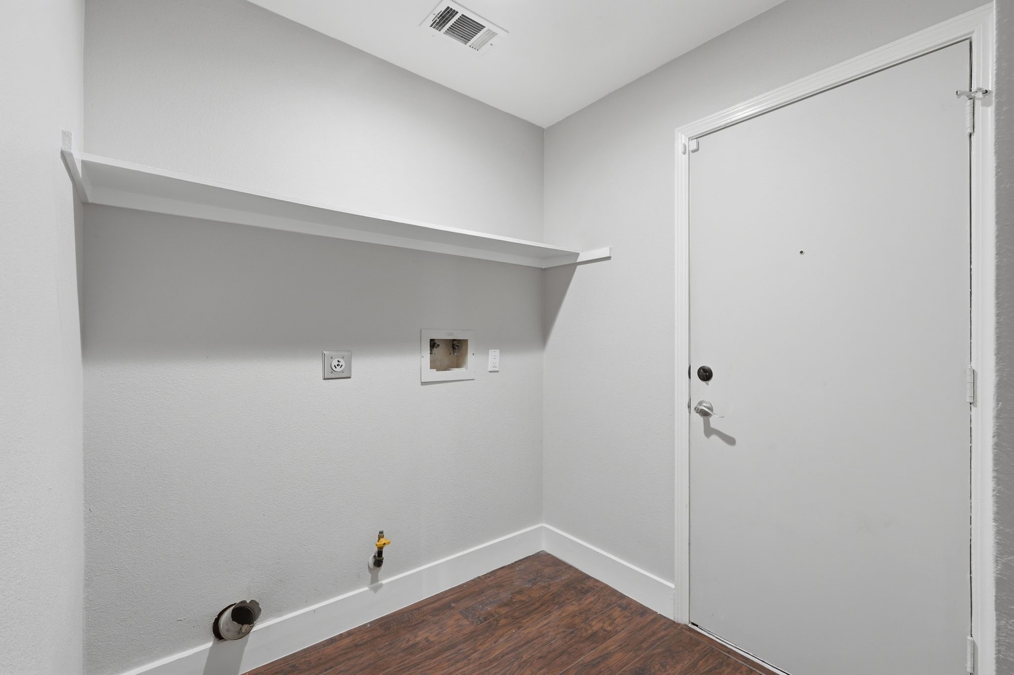 14 Dusky Meadow Place Spring, TX 77381 - Photo 36 of 47 Laundry room with storage shelf. The door leads to the two car garage.