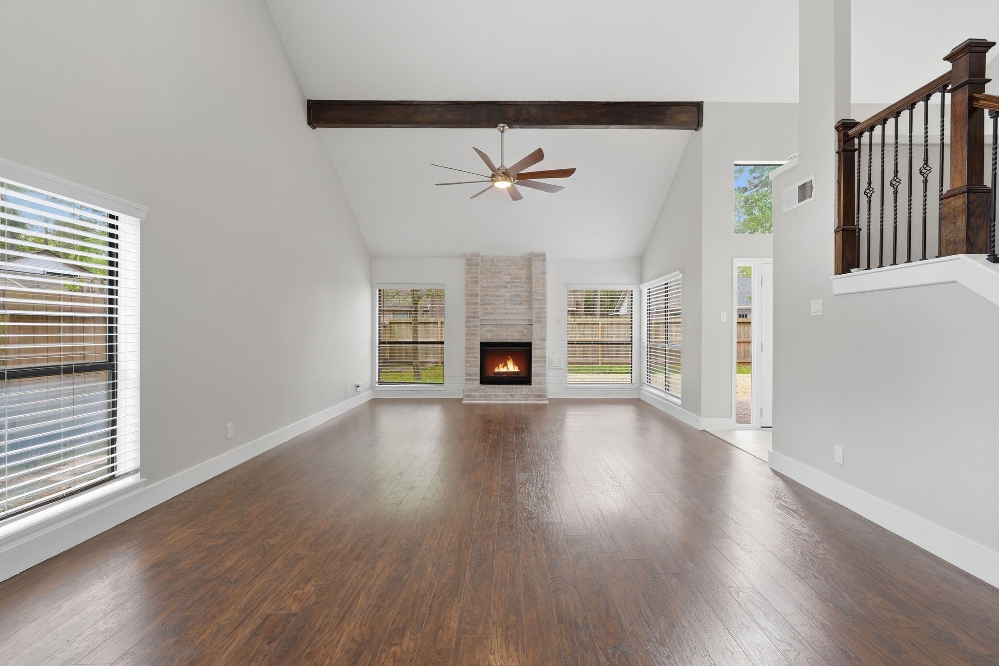 14 Dusky Meadow Place Spring, TX 77381 - Photo 6 of 47 Very spacious with vaulted ceilings and wood beam accents.