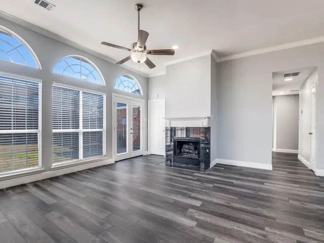 a view of livingroom with hardwood floor and a ceiling fan