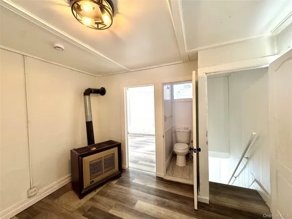 a view of entryway with wooden floor