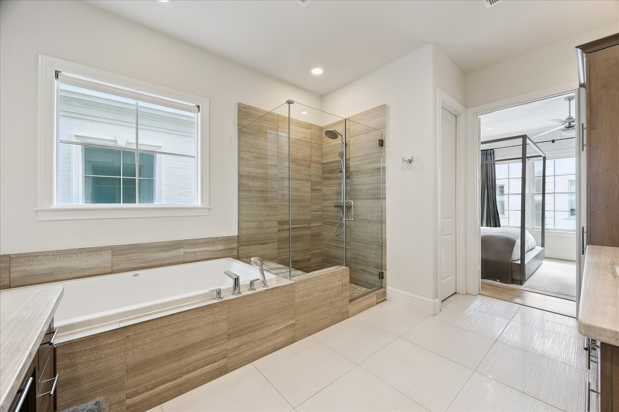 6108 Nicholas Grove Place Houston, TX 77055 - Photo 13 of 29 Whether you prefer a long soak or a refreshing shower, this bath delivers both with a jetted tub and an oversized shower complete with a convenient bench seat.