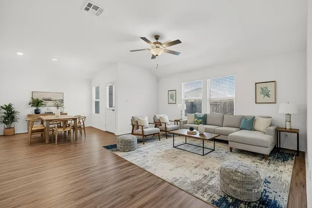 a living room with furniture and a table