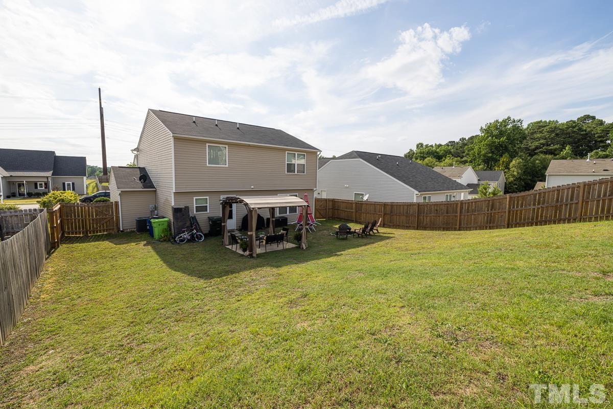 4818 Kitledge Drive Raleigh, NC 27610 - Photo 23 of 23 a view of a house with backyard and sitting area